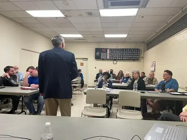 A speaker addressing a committee meeting